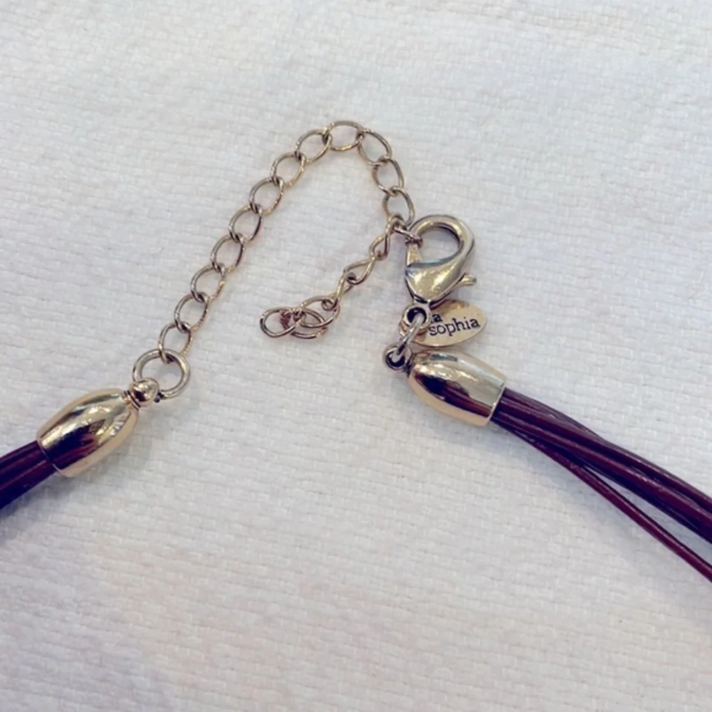 Lia Sophia Buona Sera amber pendant brown leather cord necklace